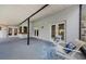 Entertainers screened lanai with views, seating, pass through window and multiple access doors at 2609 Sunnyside Cir, Palm Harbor, FL 34684