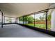 Large screened lanai, perfect for outdoor entertaining with a view of the backyard at 2609 Sunnyside Cir, Palm Harbor, FL 34684