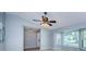 Bright living room features large windows and neutral walls providing a calm space at 2609 Sunnyside Cir, Palm Harbor, FL 34684