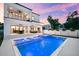 Outdoor living at its finest: a pool with a spa, patio, and manicured yard at 2707 Ridgewood Ave, Tampa, FL 33602