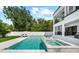 Luxury home featuring a pool with hot tub, outdoor kitchen, and a covered patio at 2707 Ridgewood Ave, Tampa, FL 33602