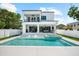 Backyard view featuring a pool, hot tub, outdoor kitchen and covered patio at 2707 Ridgewood Ave, Tampa, FL 33602