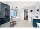 Modern bathroom featuring glass shower, soaking tub, geometric tile, and contemporary lighting fixtures at 2707 Ridgewood Ave, Tampa, FL 33602