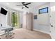 Clean, bright bedroom with a mounted TV and a large Murphy bed at 2707 Ridgewood Ave, Tampa, FL 33602