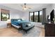 Bedroom featuring a window, futon, area rug, and ceiling fan at 2707 Ridgewood Ave, Tampa, FL 33602