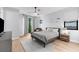 Neutral bedroom with large windows, ceiling fan, area rug, and seating area at 2707 Ridgewood Ave, Tampa, FL 33602