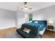 This bedroom features a ceiling fan, a day bed and an area rug on the hardwood floors at 2707 Ridgewood Ave, Tampa, FL 33602