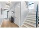 Bright hallway showcasing modern light fixtures and a staircase leading to the upper level at 2707 Ridgewood Ave, Tampa, FL 33602