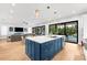 Spacious kitchen with a large island, stainless steel appliances and an open floor plan to the living room at 2707 Ridgewood Ave, Tampa, FL 33602