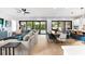 Open-concept living area flows seamlessly into the dining and kitchen, offering bright, connected living spaces at 2707 Ridgewood Ave, Tampa, FL 33602