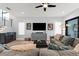 Comfortable living room features a large sectional sofa, modern decor, and open access to outdoor space at 2707 Ridgewood Ave, Tampa, FL 33602