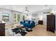 Luxurious main bedroom boasts large windows, a ceiling fan, and ample space at 2707 Ridgewood Ave, Tampa, FL 33602
