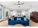 Luxurious main bedroom boasts large windows, a ceiling fan, and ample space at 2707 Ridgewood Ave, Tampa, FL 33602