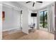 Bright office space with modern desk, chair and a view to the front yard at 2707 Ridgewood Ave, Tampa, FL 33602