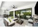 This covered outdoor area is an ideal space for entertaining and relaxing by the pool at 2707 Ridgewood Ave, Tampa, FL 33602