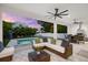 Covered outdoor patio features comfortable seating and dining with views of the pool and landscaped yard at 2707 Ridgewood Ave, Tampa, FL 33602
