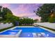 Pool with integrated hot tub and sun loungers provides a luxurious outdoor experience at 2707 Ridgewood Ave, Tampa, FL 33602