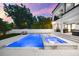 A luxurious pool and spa with marble accents offer an ideal setting for relaxation and entertaining at 2707 Ridgewood Ave, Tampa, FL 33602