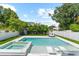 This stunning pool area features a jacuzzi and an area for sunbathing at 2707 Ridgewood Ave, Tampa, FL 33602