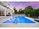 A backyard oasis features a pool, spa, and patio for the ultimate relaxation and entertaining at 2707 Ridgewood Ave, Tampa, FL 33602