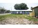 Exterior view showing the side and backyard of the home, along with its surroundings at 3009 N 13Th St, Tampa, FL 33605