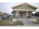 Charming single-story home with a fenced front yard, porch, and well-maintained exterior at 3009 N 13Th St, Tampa, FL 33605