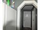 Hallway with door and laminate floors at 3009 N 13Th St, Tampa, FL 33605
