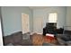 A cozy living room with light blue walls, two couches, and a TV console against the wall at 3009 N 13Th St, Tampa, FL 33605