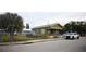 Street view showcasing the home's facade, nearby street, and mature landscaping around the area at 3009 N 13Th St, Tampa, FL 33605