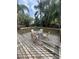 Outdoor patio with seating; features a table with four chairs on a wooden deck at 302 W Fern St, Tampa, FL 33604