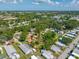 Aerial view of the home showcasing the backyard, mature trees and a pool at 317 Elizabeth Ave, Clearwater, FL 33759
