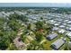 Aerial view of the home showing mature trees, a pool, and the spacious backyard at 317 Elizabeth Ave, Clearwater, FL 33759