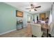 Bright dining room with tiled floors, neutral paint, and a table set for six creating an inviting atmosphere at 317 Elizabeth Ave, Clearwater, FL 33759