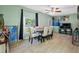 The dining room has tiled floors, neutral paint, large windows, and a table set for six with decor at 317 Elizabeth Ave, Clearwater, FL 33759