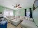 Inviting living room featuring a large sectional sofa, providing comfort for relaxing and entertaining at 317 Elizabeth Ave, Clearwater, FL 33759