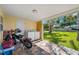 Back patio with laundry and electric motorcycles, seamlessly connecting indoor amenities with outdoor enjoyment at 317 Elizabeth Ave, Clearwater, FL 33759
