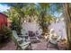 Backyard with a stone fire pit and surrounded by comfortable seating, perfect for outdoor enjoyment at 4106 N Central Ave, Tampa, FL 33603
