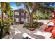 Large backyard with patio, stairs to the deck and lush landscaping create a perfect outdoor setting at 4106 N Central Ave, Tampa, FL 33603