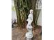 Backyard featuring a statue and lush bamboo, creating a serene and private outdoor space at 4106 N Central Ave, Tampa, FL 33603