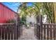 Cozy backyard features an arbor leading to a fire pit with seating, perfect for outdoor gatherings at 4106 N Central Ave, Tampa, FL 33603
