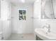 Bright bathroom offers a walk-in shower, subway tile, and an updated vanity at 4106 N Central Ave, Tampa, FL 33603