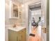 Bathroom featuring natural light, wainscotting, and modern fixtures at 4106 N Central Ave, Tampa, FL 33603