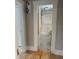 Charming bathroom featuring a toilet, patterned rug, and window, offering a cozy and functional space at 4106 N Central Ave, Tampa, FL 33603