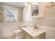 Bathroom featuring natural light, wainscotting, and modern fixtures at 4106 N Central Ave, Tampa, FL 33603