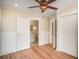 Bright bedroom with a bathroom ensuite features beautiful floors and a ceiling fan at 4106 N Central Ave, Tampa, FL 33603