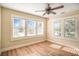Sun-filled bedroom with hardwood floors and many windows offers a bright and airy atmosphere at 4106 N Central Ave, Tampa, FL 33603