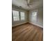 Bright bedroom featuring a ceiling fan and two windows, offering a comfortable retreat at 4106 N Central Ave, Tampa, FL 33603