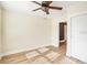 Sun-filled bedroom with hardwood floors and a ceiling fan has an attached bathroom at 4106 N Central Ave, Tampa, FL 33603