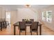 Inviting dining room with wood floors and a decorative ceiling fan chandelier at 4106 N Central Ave, Tampa, FL 33603