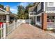 Spacious brick paver driveway leading to a charming two-story home with a well-maintained yard at 4106 N Central Ave, Tampa, FL 33603